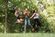 interns jumping in the woods together