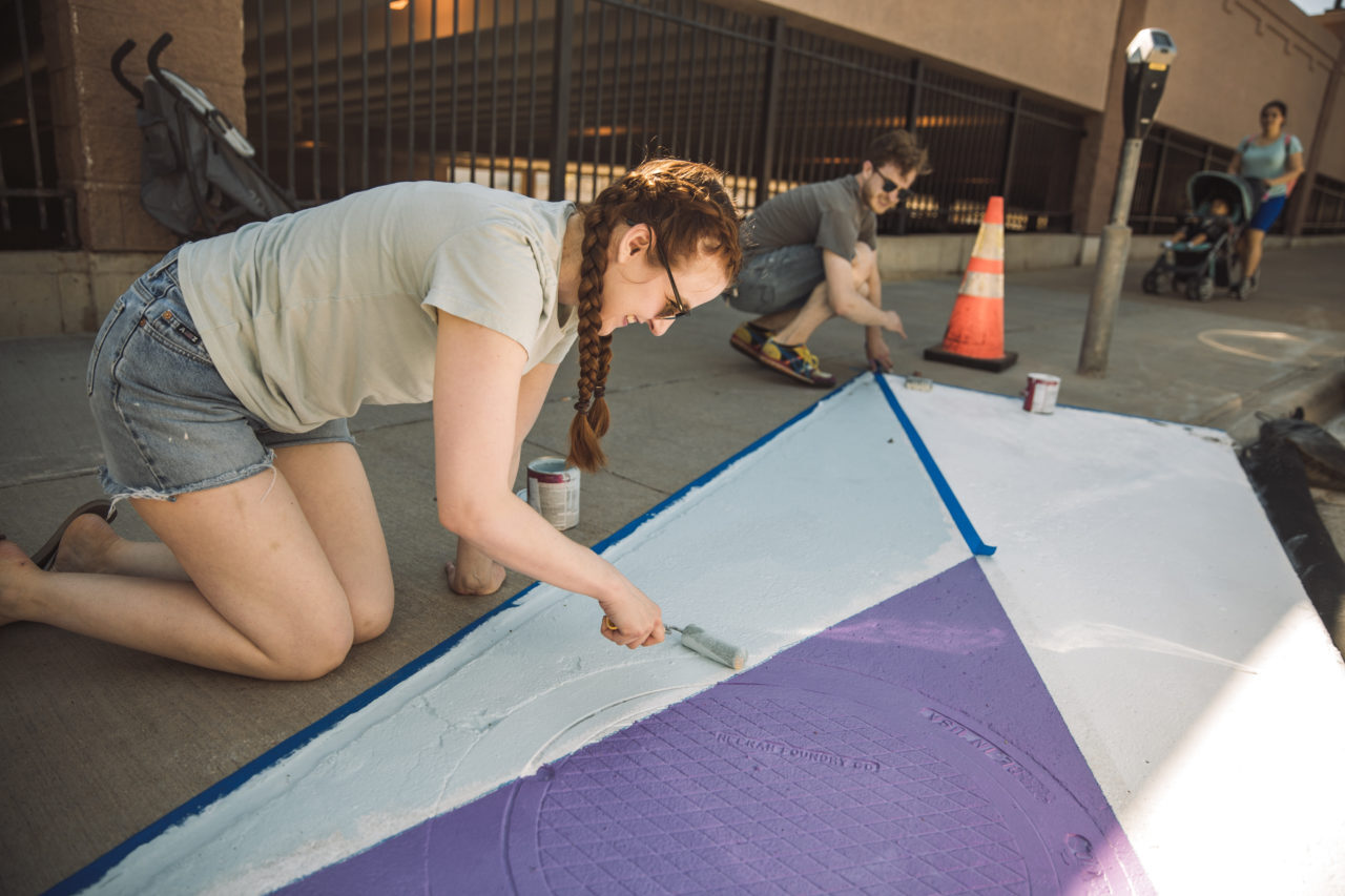 Molly painting with blue paint