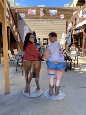 Lemonly duo sitting in western themed chairs