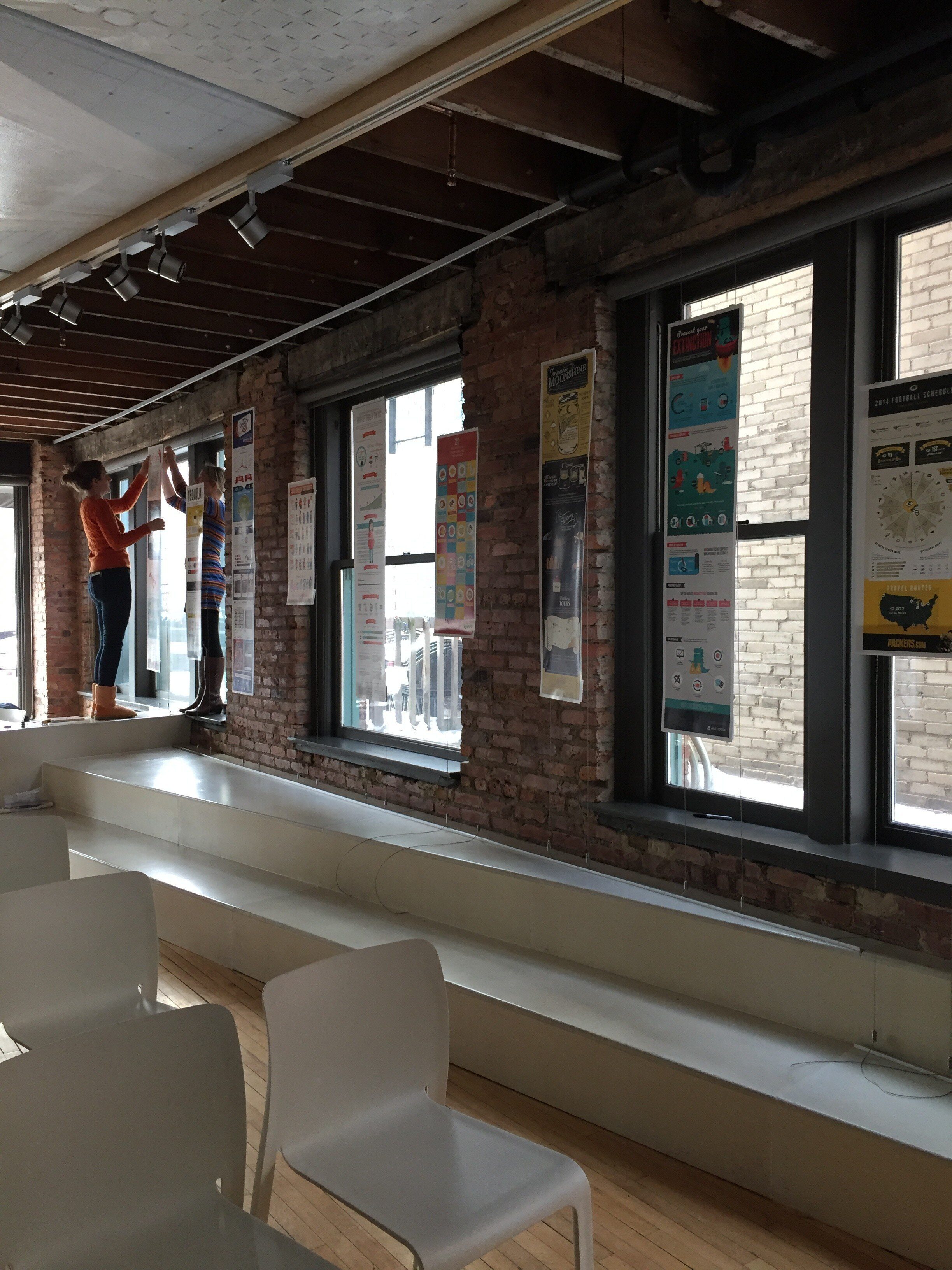 woman setting up Lemonly gallery