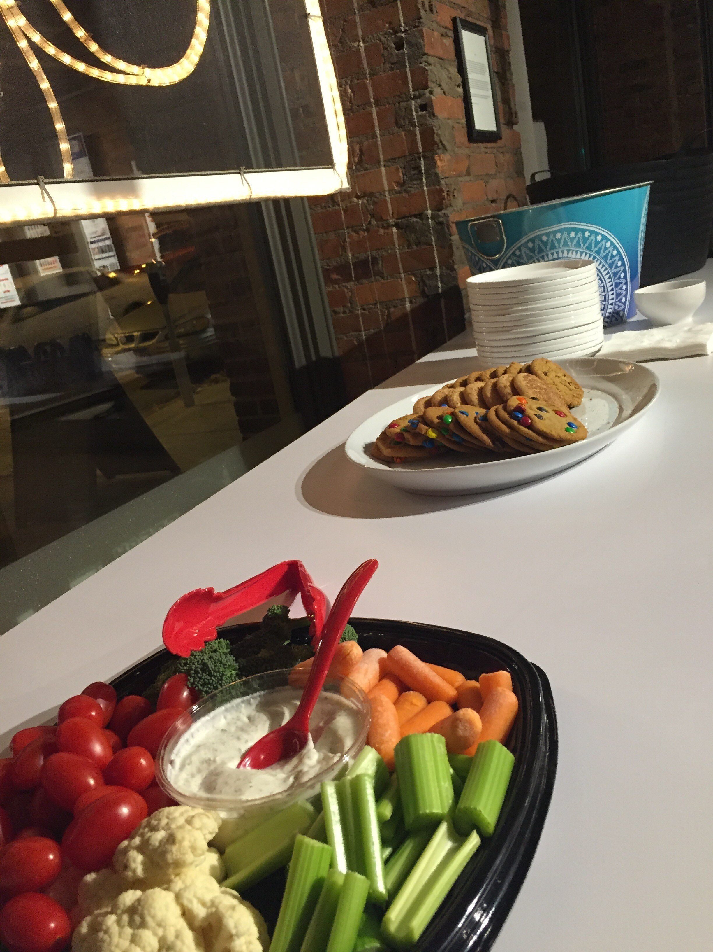vegetable tray next to cookie tray