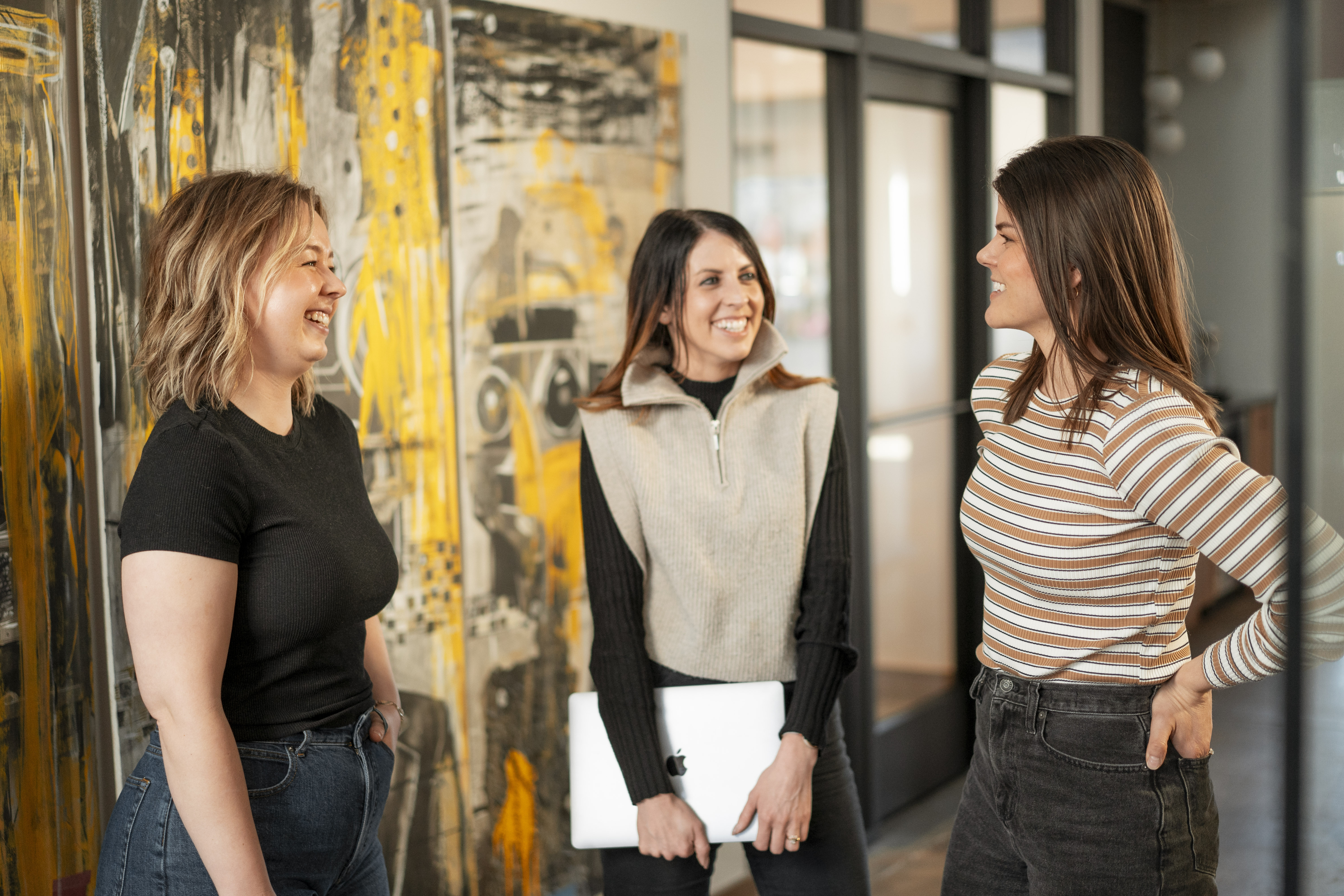 Lemonly team members smiling and talking